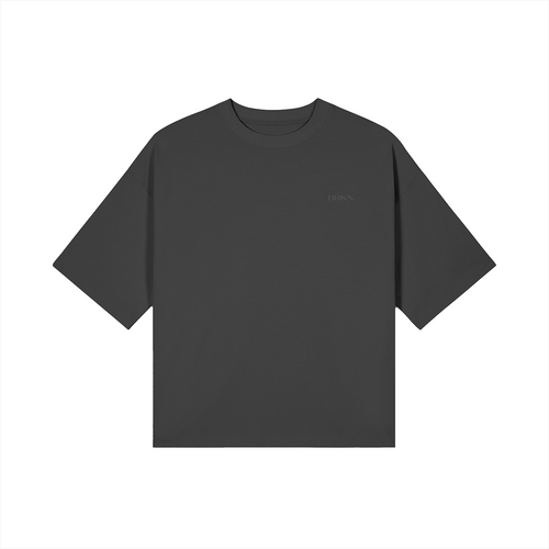 Dark gray minimalist oversized t-shirt with subtle chest logo, premium streetwear essential