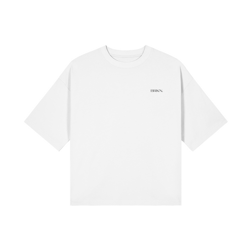 White minimalist streetwear t-shirt with subtle BRKN. logo, oversized fit, clean design for everyday wear